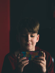 boy gaming on smartphone © Oxana