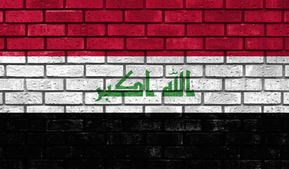Fototapeta na wymiar Iraq flag on a brick wall