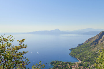 Fototapeta premium Aerial view of Maratea, coast of Basilicata in Southern Italy. Beautiful mind-bending view of the blue sea, ideal landscape for contemplation and meditation. Wallpaper or background of nature