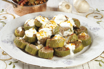 sliced ​​stuffed zucchini with garlic yogurt