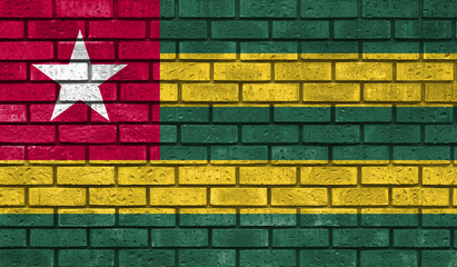 Togo flag on a brick wall