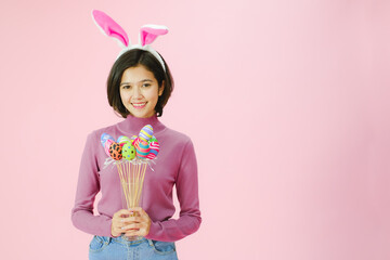 Portrait beautiful young asia girl with painted eggs, Happy easter day