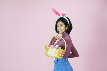 Portrait beautiful young asia girl with painted eggs, Happy easter day