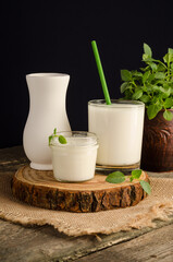Dairy starter culture for the preparation of fermented milk products, yogurt, kefir in a glass on a wooden cut