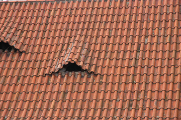 Naklejka premium Red tiles roof close up of the house.