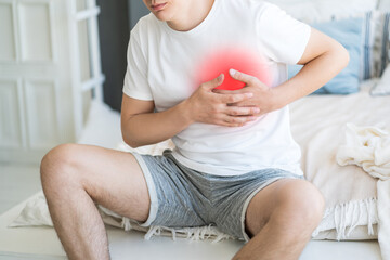 Heart attack, man with chest pain suffering at home