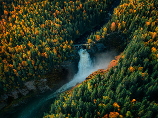 Hällingsåfallet waterfall in autumn forest near Strömsund in Jämtland in Sweden from above. - 474397326