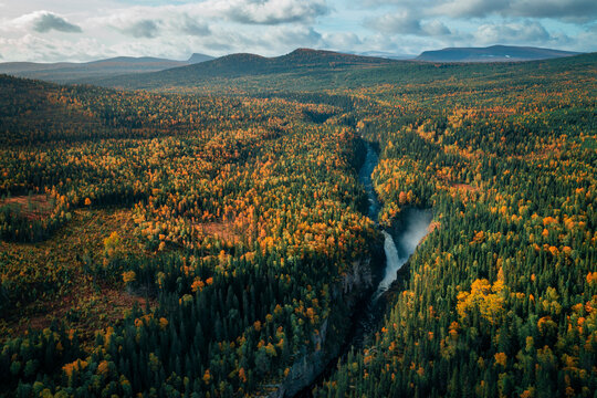 H&auml;llings&aring;fallet waterfall in autumn forest near Str&ouml;msund in J&auml;mtland in Sweden from above.