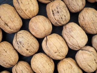 Fresh, whole walnuts close-up. Flat lay. Background