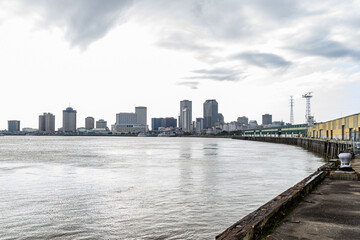 Skyline of New Orleans from the Mississippi River wharves to the skyline of the French Quarter and...