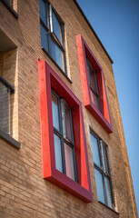 Modern red brick building.