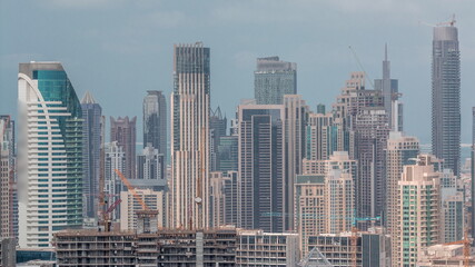 Obraz na płótnie Canvas Panoramic skyline of Dubai with business bay and downtown district timelapse.