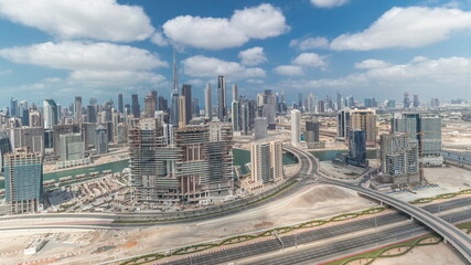 Fototapeta na wymiar Panorama showing skyline of Dubai with business bay and downtown district timelapse.