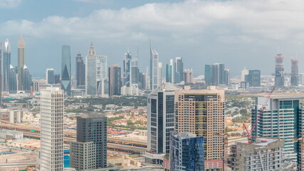 Rows of skyscrapers in financial district and business bay in Dubai aerial timelapse.