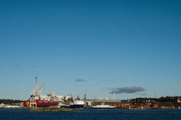 Fototapeta na wymiar Scenic cityscape of modern norwegian town. Modern cargo port of Stavanger. Sunny day.