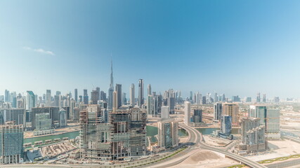 Fototapeta na wymiar Panoramic skyline of Dubai with business bay and downtown district all day timelapse.