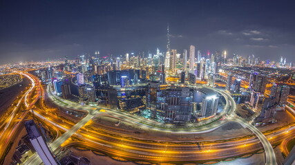 Fototapeta na wymiar Panoramic skyline of Dubai with business bay and downtown district night timelapse.