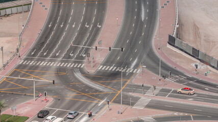 Top view city traffic on a big crossroad in Business bay timelapse.