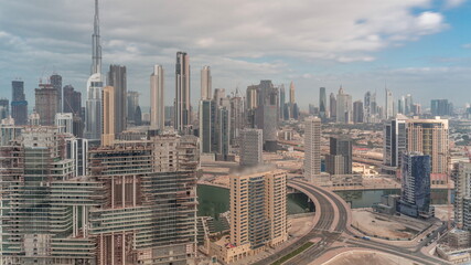 Panoramic skyline of Dubai with business bay and downtown district timelapse.