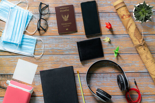 Overhead view of Traveler's accessories, Essential vacation items, Travel concept background,Face mask