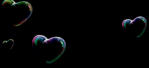 Colorful hearts flying on black background