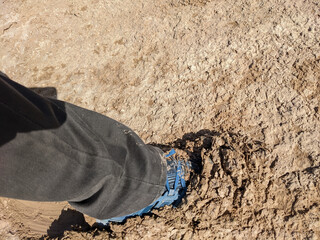photo of foot step in wet muddy ground