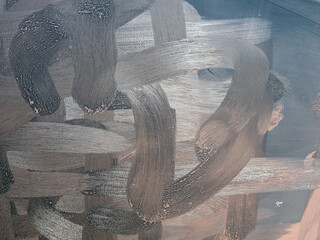 Dirty tablet. Fingerprints form drawings made with dust, moisture and grease marked with fingers on the touchscreen tablet or smartphone screen. Close up.