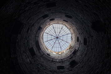 Inside view of the thousand-year-old fortress tower. Historic stone tower. Selective focus.