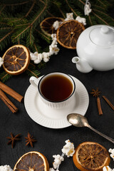 Christmas tea party with christmas tree, dried oranges and popcorn garland