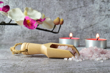 Wooden spoon with bath salts, for relaxing moments. Stone background and copy space.