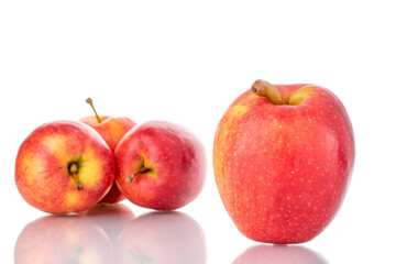 Several ripe red apples, close-up, isolated on white.