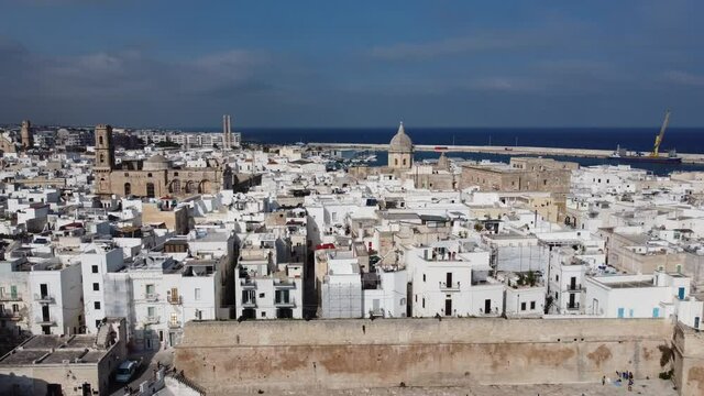 Flight over the city of Monopoli in Italy at the Italian east coast - travel photography
