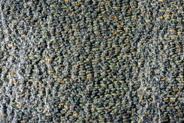 Close up shot of a stone wall with water running