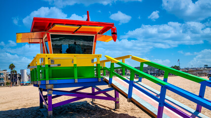 Fototapeta na wymiar Multi color, LGBT Rainbow Flag Lifeguard Hut on Hermosa Beach, California