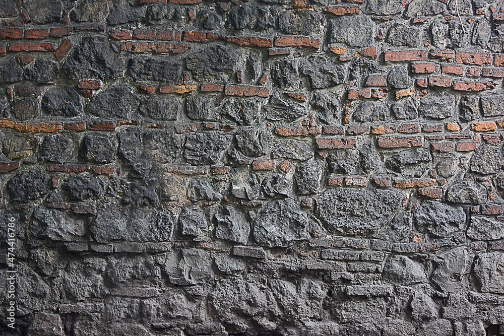 Wall mural abstract background gray wall of stones close up