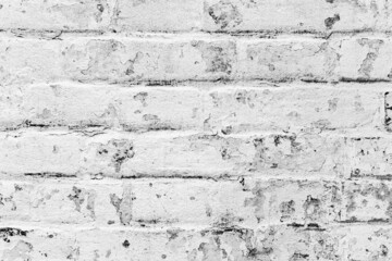 Texture of a brick wall with cracks and scratches which can be used as a background