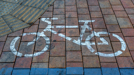 Bicycle sign on the road. Bike lane on the pavement. Road Bike detail.