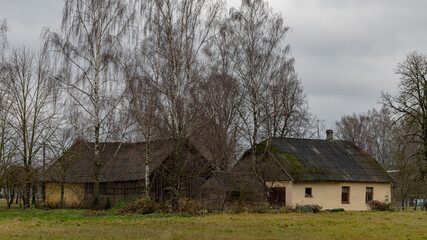 village houses in Latvian countryside. Autumn evening