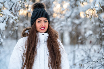 young female walking in the snowy winter day outdoor, winter forest landscape background
