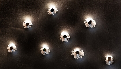Bullet holes in metal. Concept, use of firearms. - obrazy, fototapety, plakaty