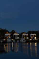 Residential area in Norway with houses facing the sea at night