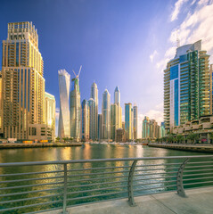 Day view of Dubai Marina bay with clear sky, UAE