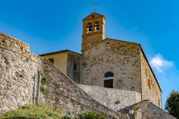 Fototapeta na wymiar Panorama on the church and bell tower of Pomarance Alta val di Cecina Tuscany Italy