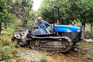 Tractor doing agricultural work in the field