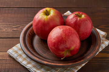 cripps pink apples on brown background