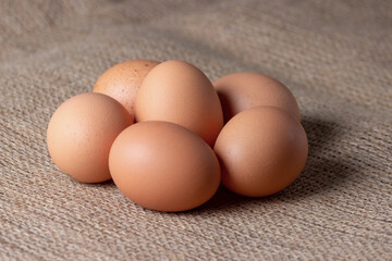 fresh eggs on jute cloth