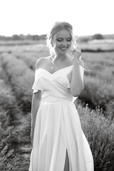 the bride in a white dress  on the lavender field
