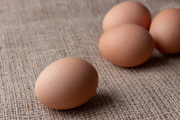fresh eggs on jute cloth