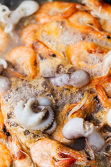 Fototapeta na wymiar Two kinds of fresh cooking seafood shrimp, octopus