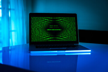 Laptop with green numbers on display. Successful login with credentials user and password in the system. Technology, communication, security, protection, intrusion, hacker attack, cyber crime concept.